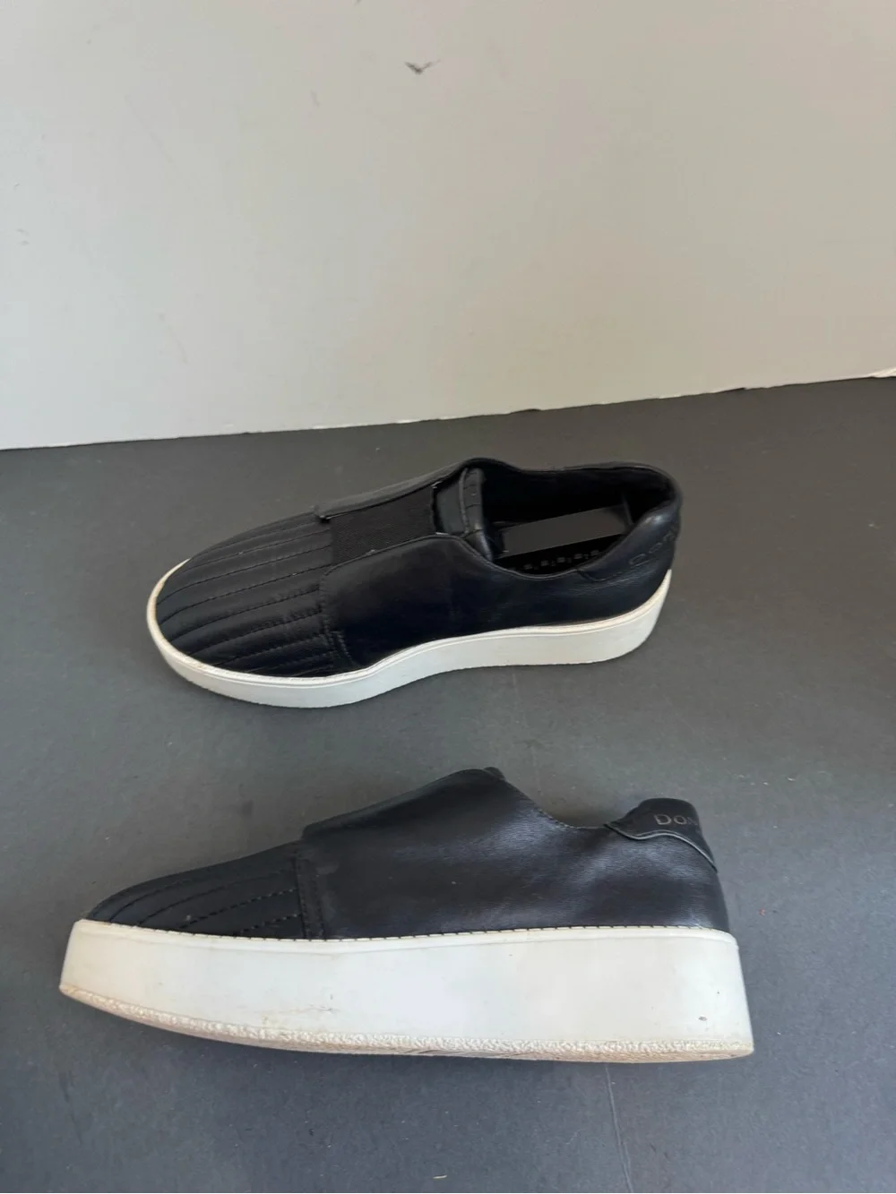 Donna Karan New York black leather slip-on sneakers. Size 6